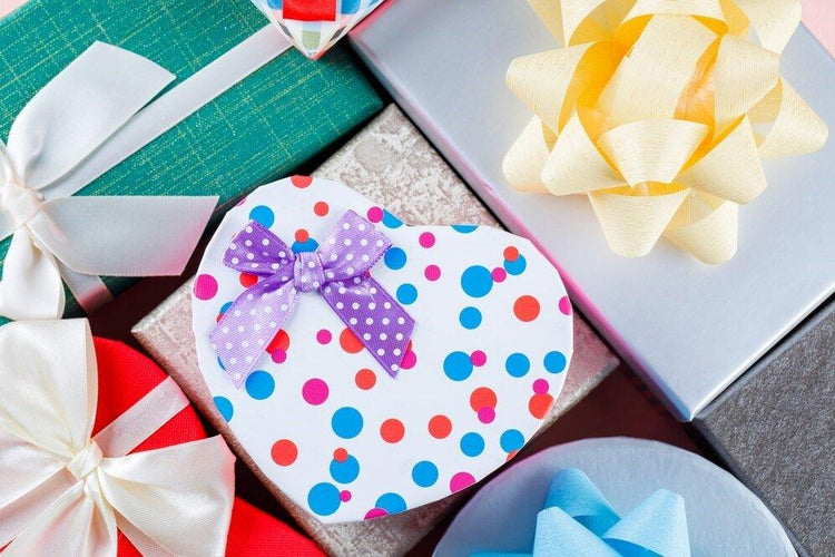 Colorful gift boxes with bows, perfect for gourmet presents and special occasions.