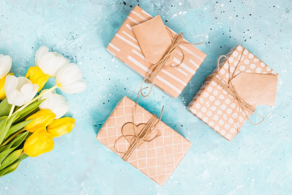 Elegant gourmet gift boxes with wine, honey, and ribbons for holidays and special occasions